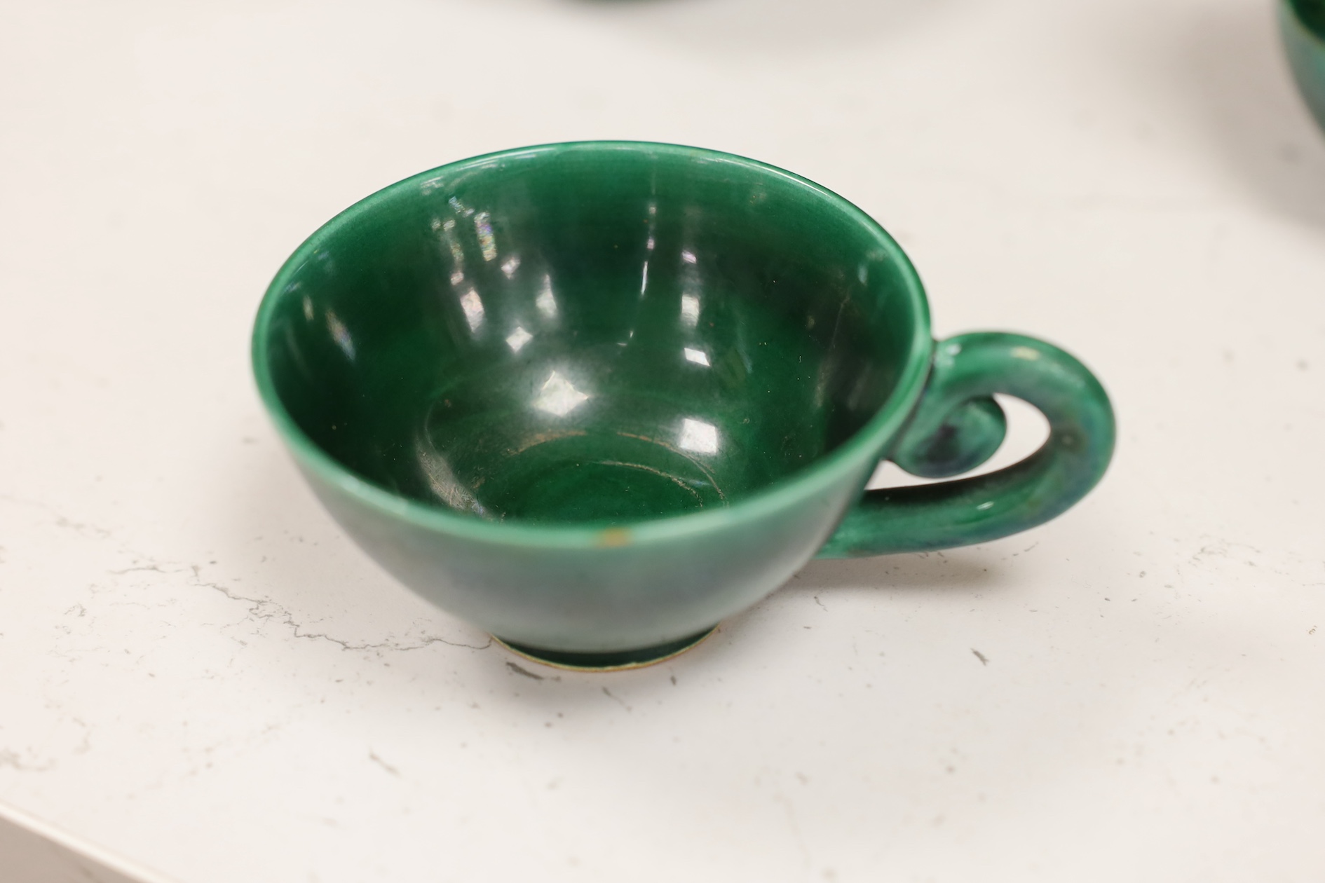 A Vallauris French bright green tea service, with six cups saucers milk jug and tea pot, jug 12.5cm high. Condition - fair to good